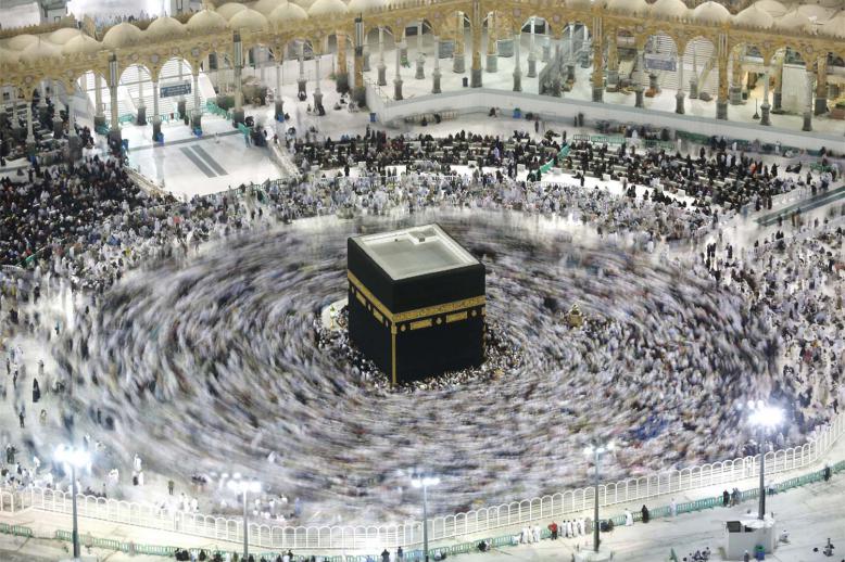 Muslim pilgrims circumambulate the Kaaba, the cubic building at the Grand Mosque, in the Muslim holy city of Mecca