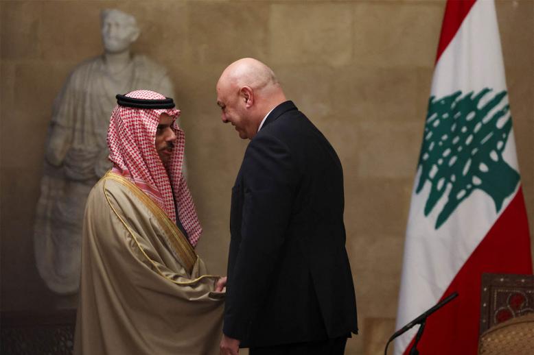 Saudi FM Prince Faisal bin Farhan Al Saud shakes hands with Lebanese President Joseph Aoun at the presidential palace, in Baabda