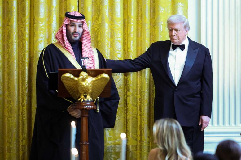 US President Donald Trump greets Saudi Crown Prince Mohammed bin Salman, during a dinner at the White House