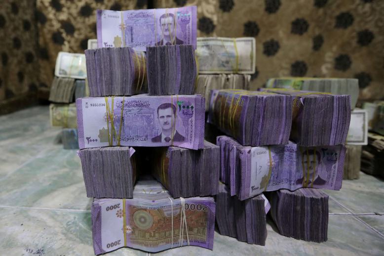 الأوراق النقدية لا تزال تذكر السوريين بمآسي عهد الأسد 
