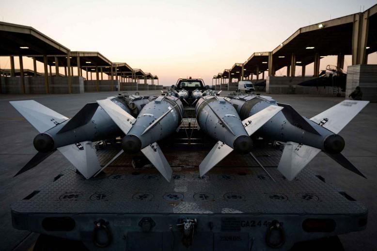 US Airmen prepare to load GBU-31 munition systems onto F-15E Strike Eagles in support of Operation Hawkeye Strike as the US military launched large-scale strikes against dozens of Islamic State targets in Syria, December 19, 2025.