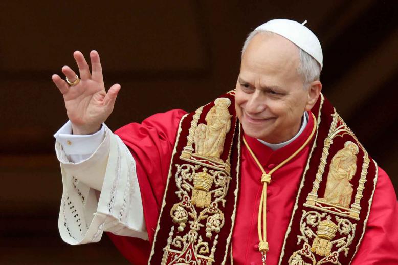 Pope Leo XIV gestures after delivering the traditional Christmas Day Urbi et Orbi speech to the city and the world from the main balcony of St. Peters Basilica at the Vatican, December 25, 2025. 