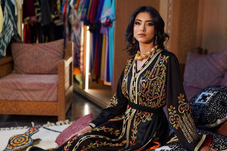 A model wearing the Moroccan caftan poses for a picture. 