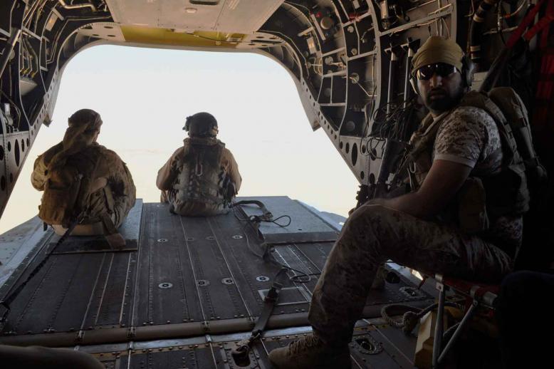 A 2015 file picture shows Emirati soldiers standing guard out the rear gate of a Chinook military helicopter travelling from Saudi Arabia to Yemen. 