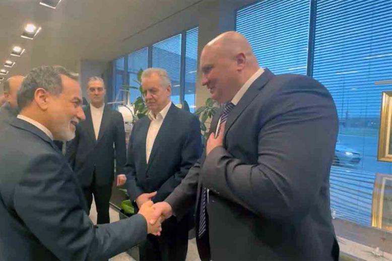 Araqchi shaking hands with Russian officials upon his arrival to St Petersburg