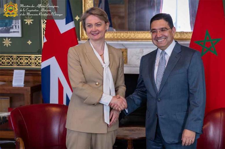 Cooper shaking hands with Bourita in London