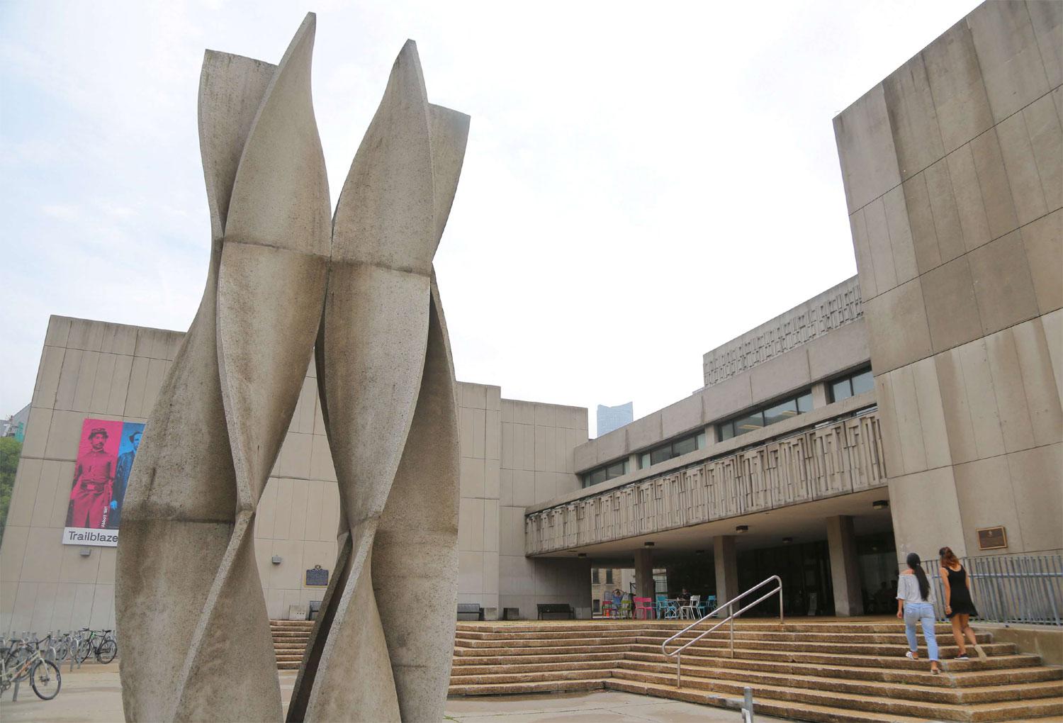 Women enter the Medical Sciences Building at the University of Toronto in Toronto, Ontario, Canada