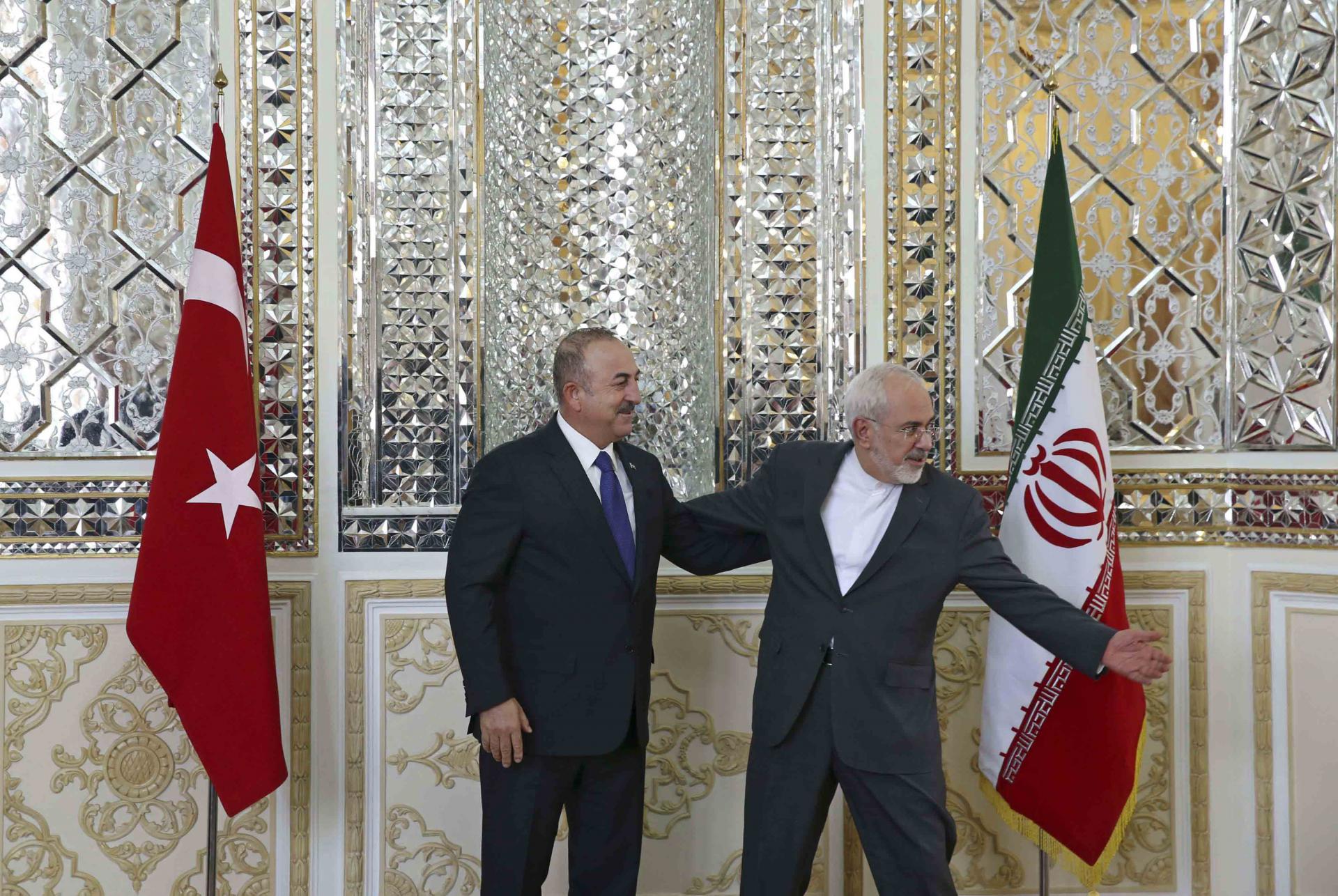 Iranian FM with Turkish counterpart in Tehran, last February