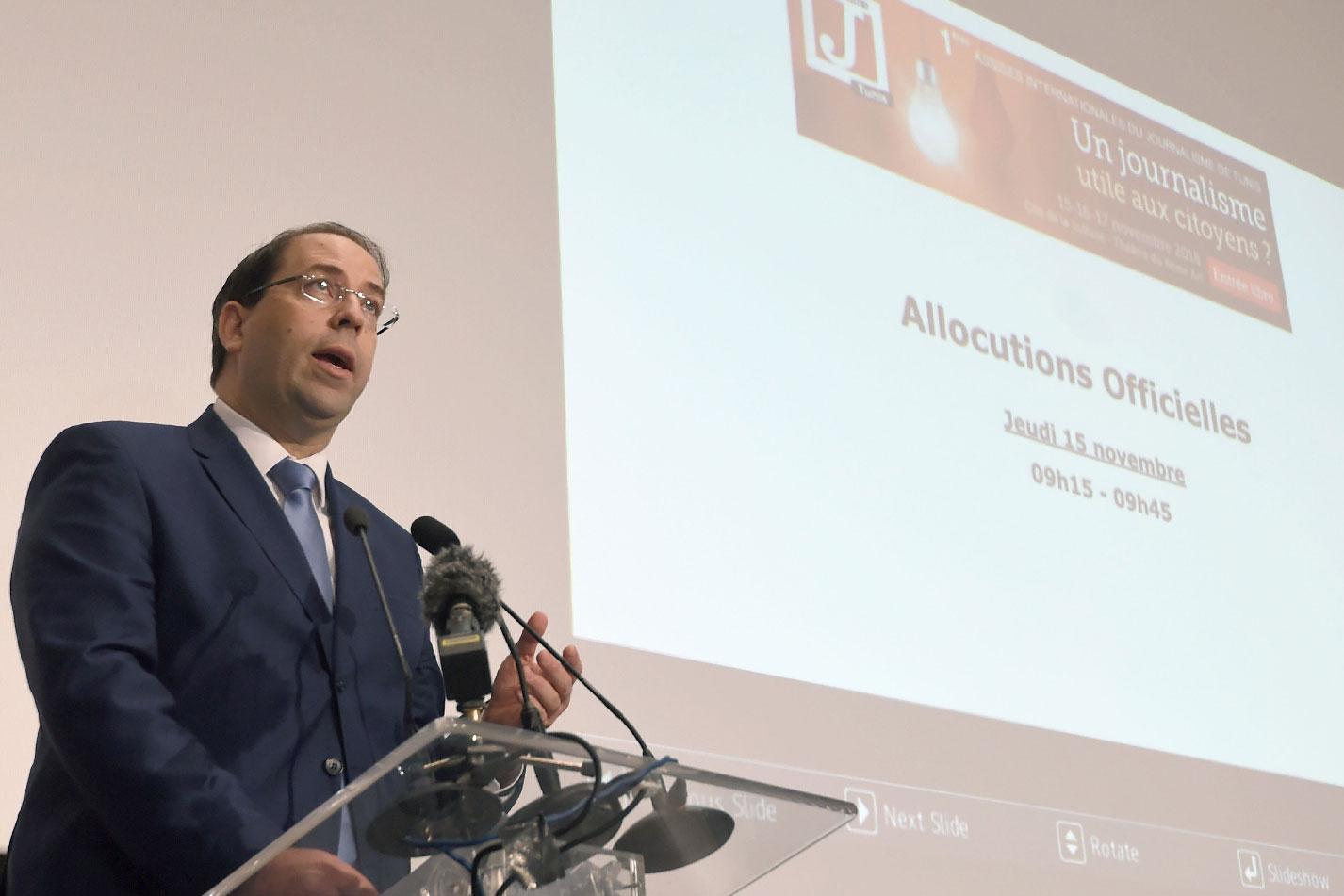 Tunisian Prime Minister Youssef Chahed delivers a speech during the opening of the Assises Internationales du Journalisme in Tunis.