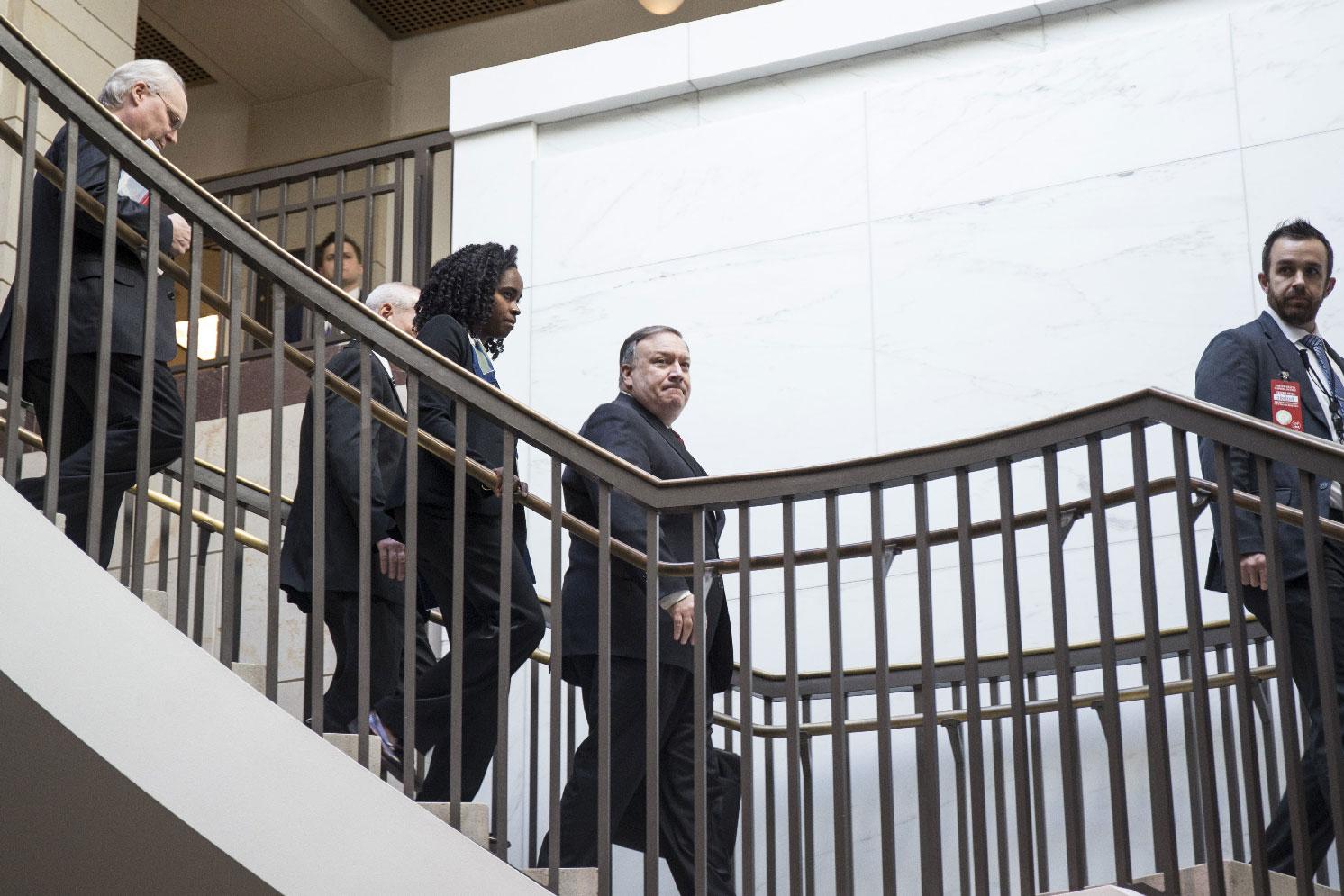 US Secretary of State Mike Pompeo walks to a briefing with members of the Senate to discuss developments in Saudi Arabia on Capitol Hill on November 28, 2018 in Washington, DC.