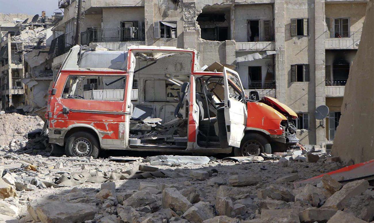 A destroyed ambulance is seen outside the Syrian Civil Defense main center after airstrikes in eastern Aleppo