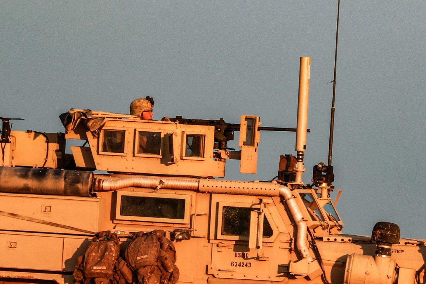 A US Marine Corps tactical vehicle is seen driving along a road near the town of Tal Baydar in the countryside of Syria's northeastern Hasakeh province on December 21, 2018.