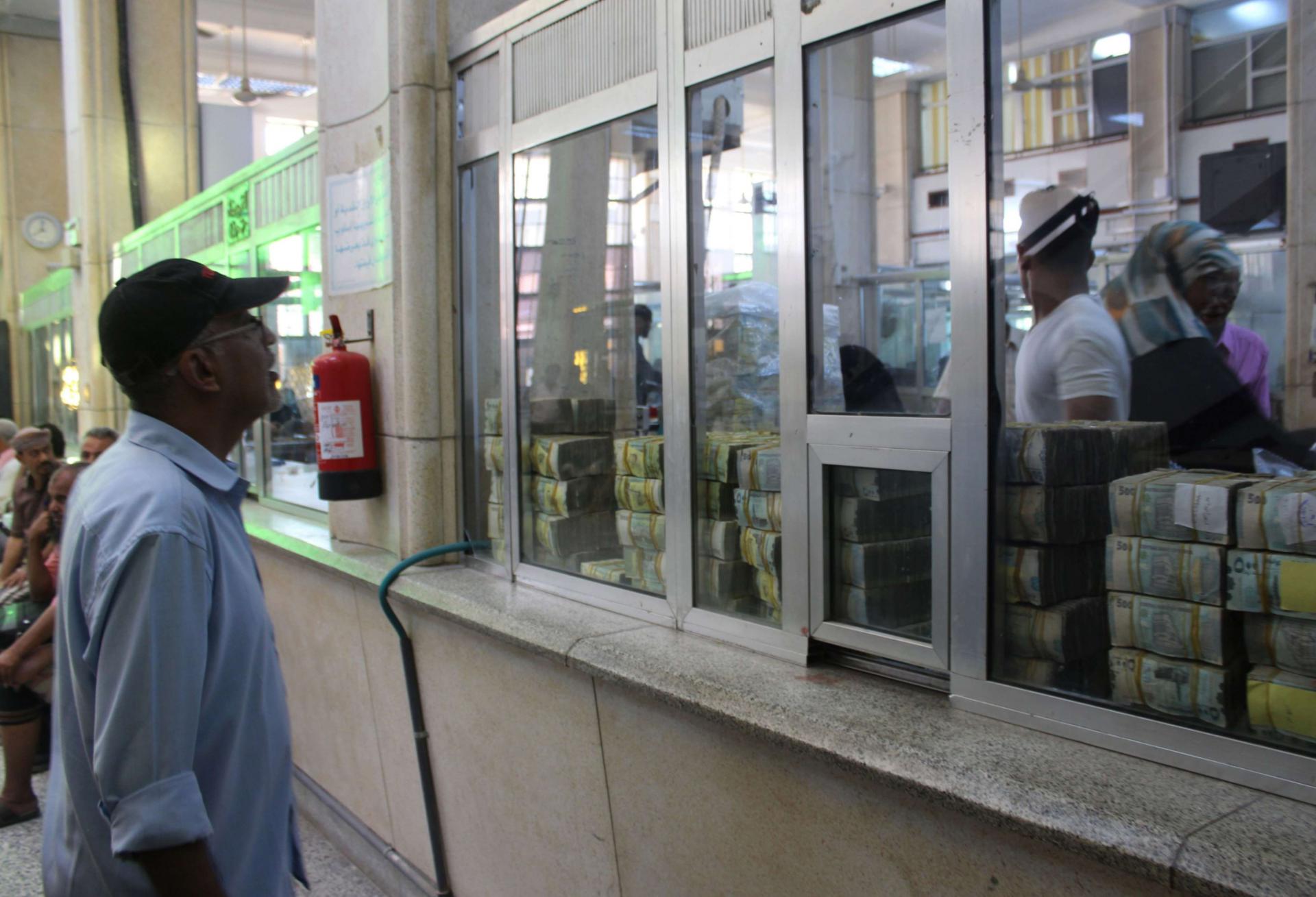 A Yemeni man is seen at the Central Bank of Aden in Aden on December 13, 2018.