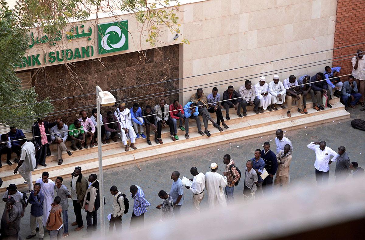 Many residents have to line up for hours to withdraw money