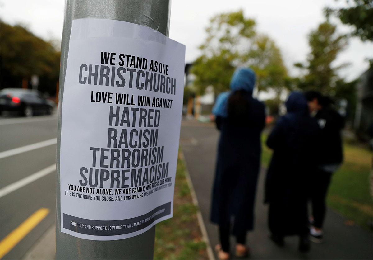 A sign is seen after Friday's mosque attacks outside a community center near Masjid Al Noor in Christchurch