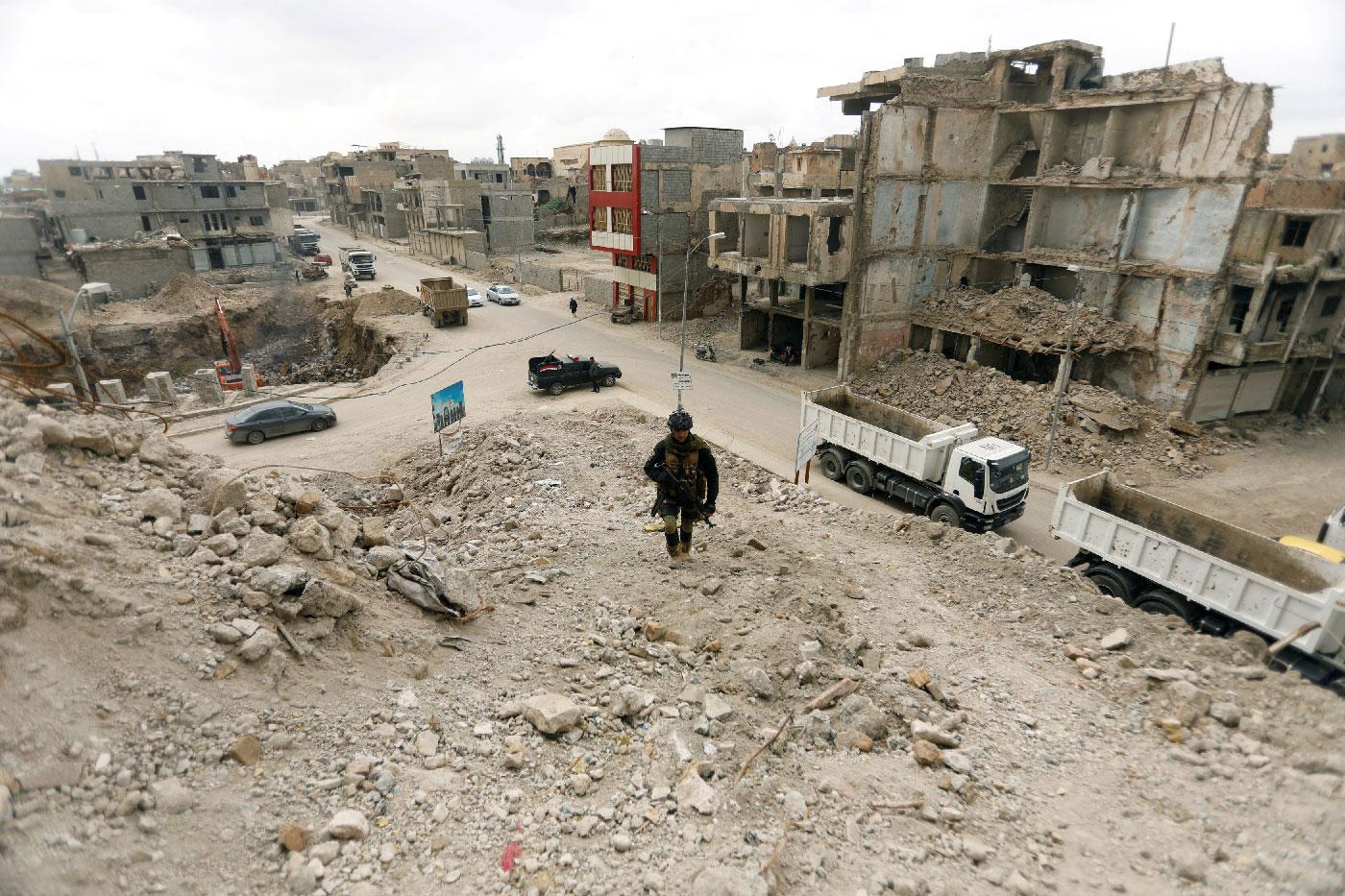 A member of the Iraqi security forces passed by bridges destroyed in the war with Islamic State, in the Old City of Mosul, Iraq, February 27, 2019.
