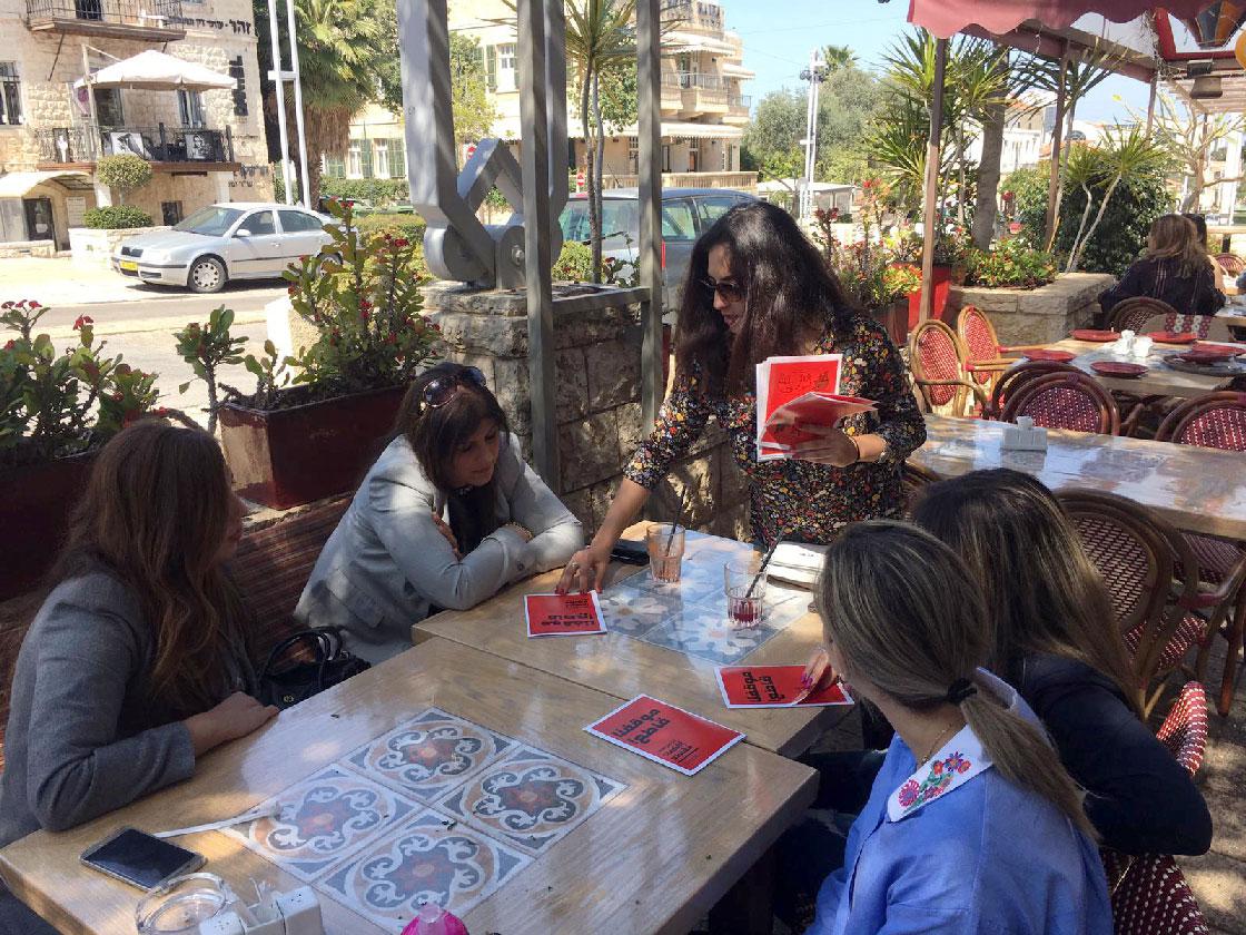 An activist distributes pro-boycott leaflets in the port city of Haifa ahead of Israel's election, Israel March 21, 2019.