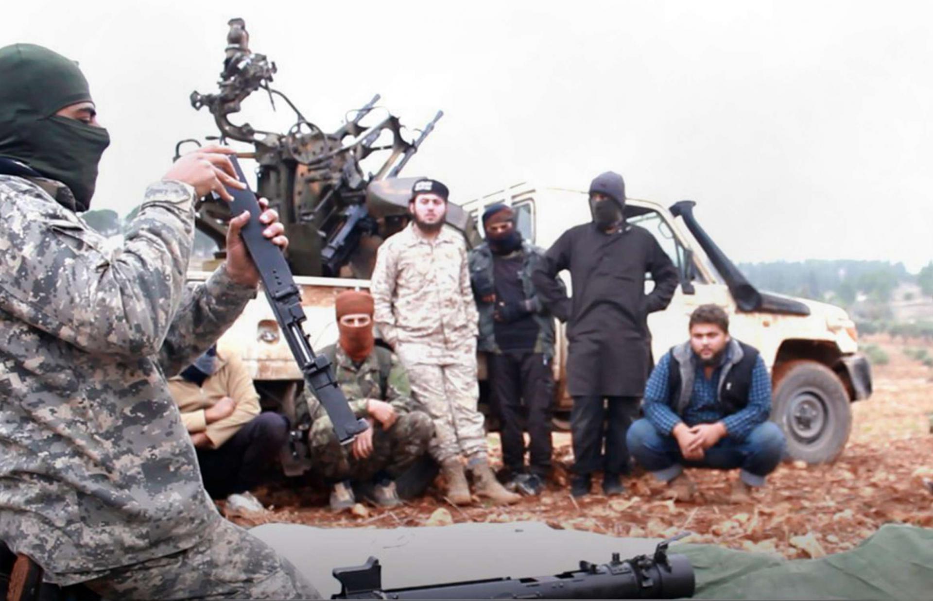 Photo shows al-Qaeda-linked militants learning how to use a heavy weapon in the countryside of Idlib