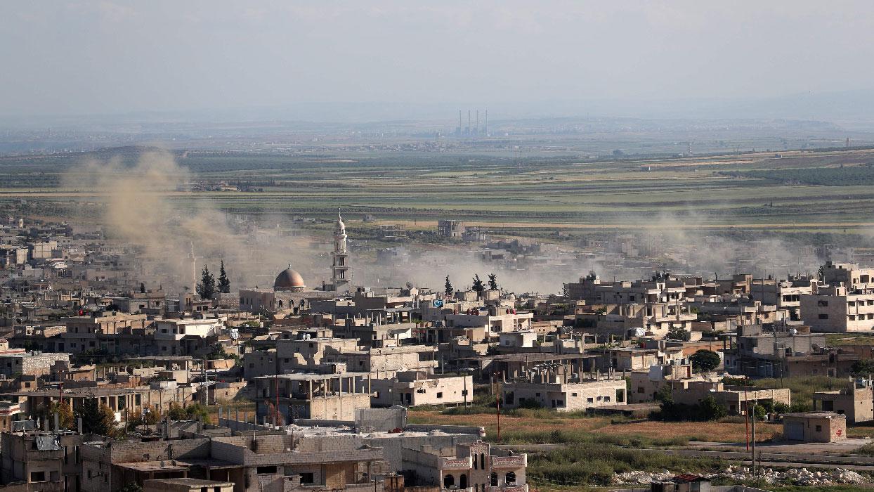 Plumes rising from shelling by government forces on the town of Khan Sheikhun