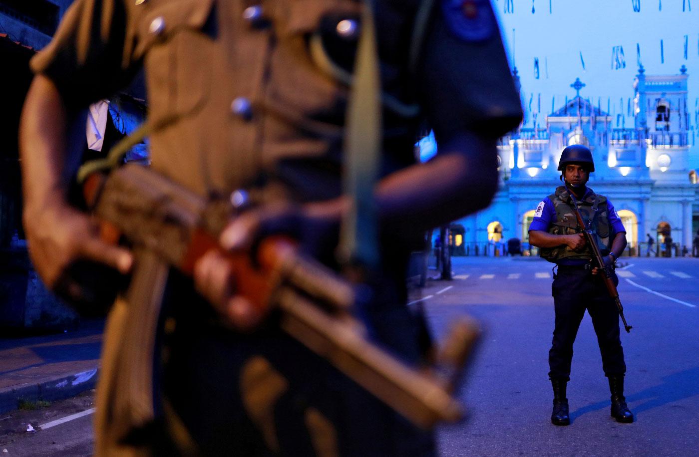 Security personnel stand guard in front of St Anthony's Shrine in Colombo, Sri Lanka