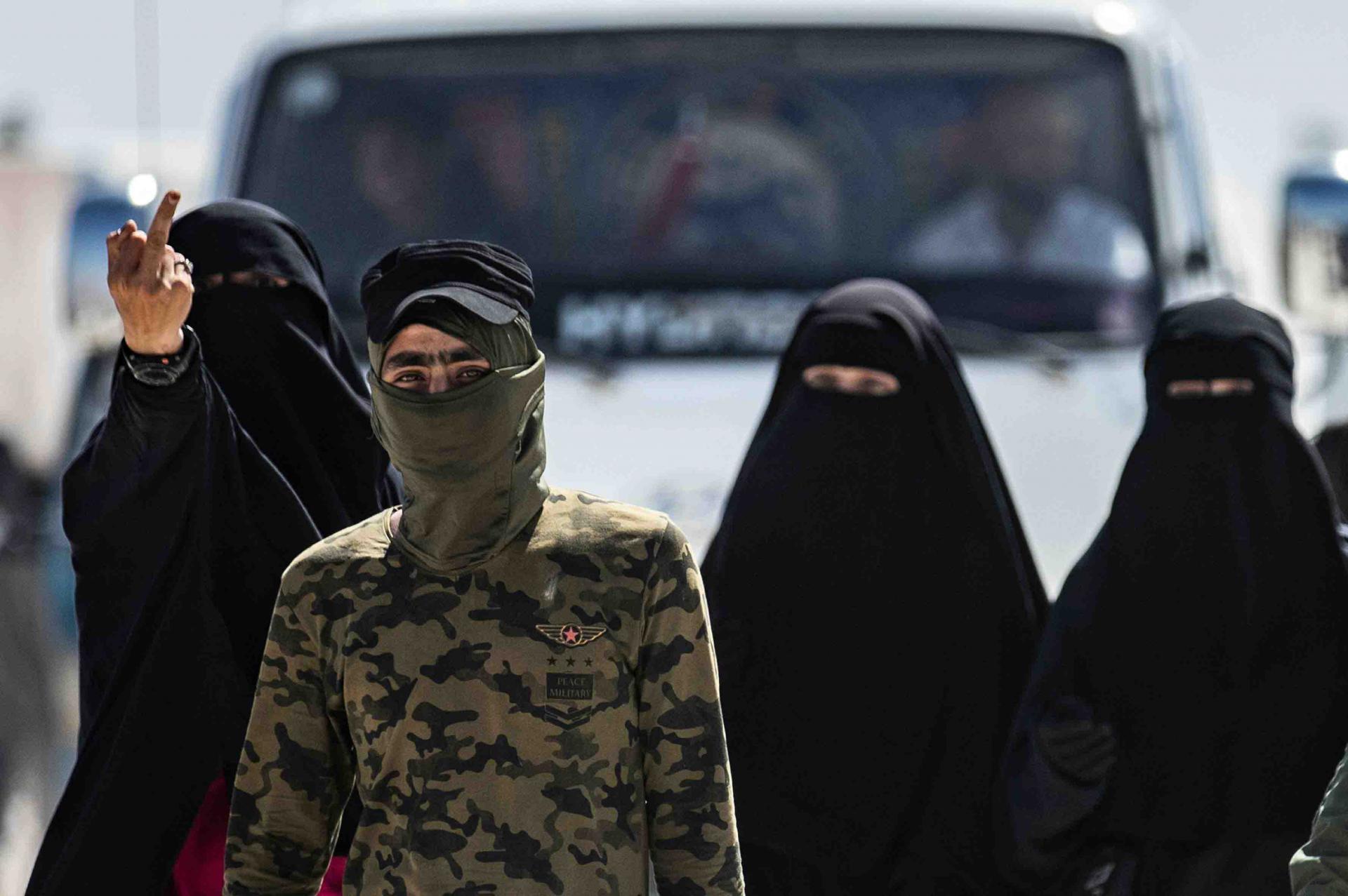 Unlike Syrian and Iraqi women who are allowed to roam the camp freely, these high-risk prisoners are escorted by armed guards