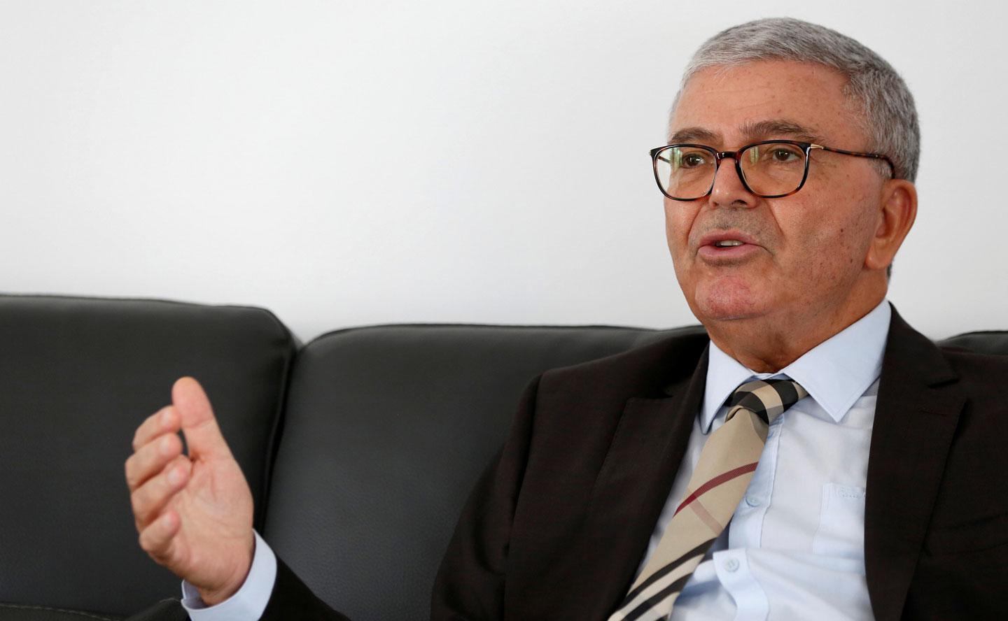 Tunisian Minister of Defense Abdelkarim Zbidi, an independent candidate in the upcoming presidential elections race, gestures during an interview with Reuters in Tunis