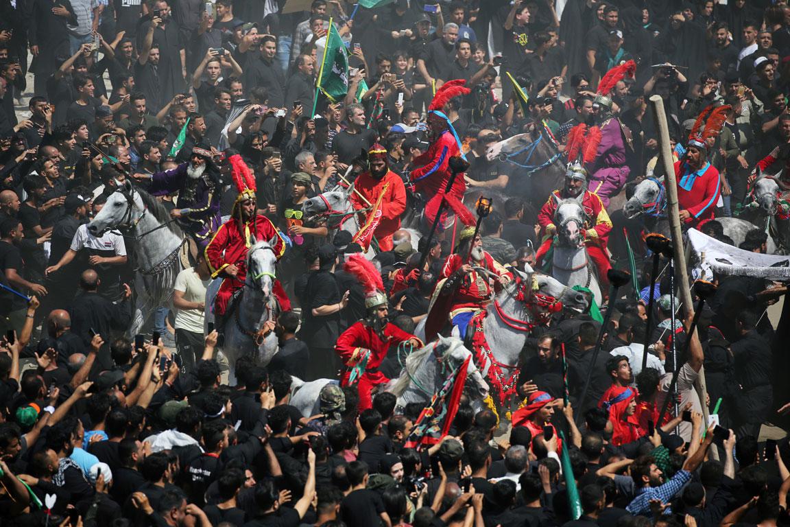 Local actors dressed as ancient warriors re-enact a scene from the 7th century battle of Kerbala