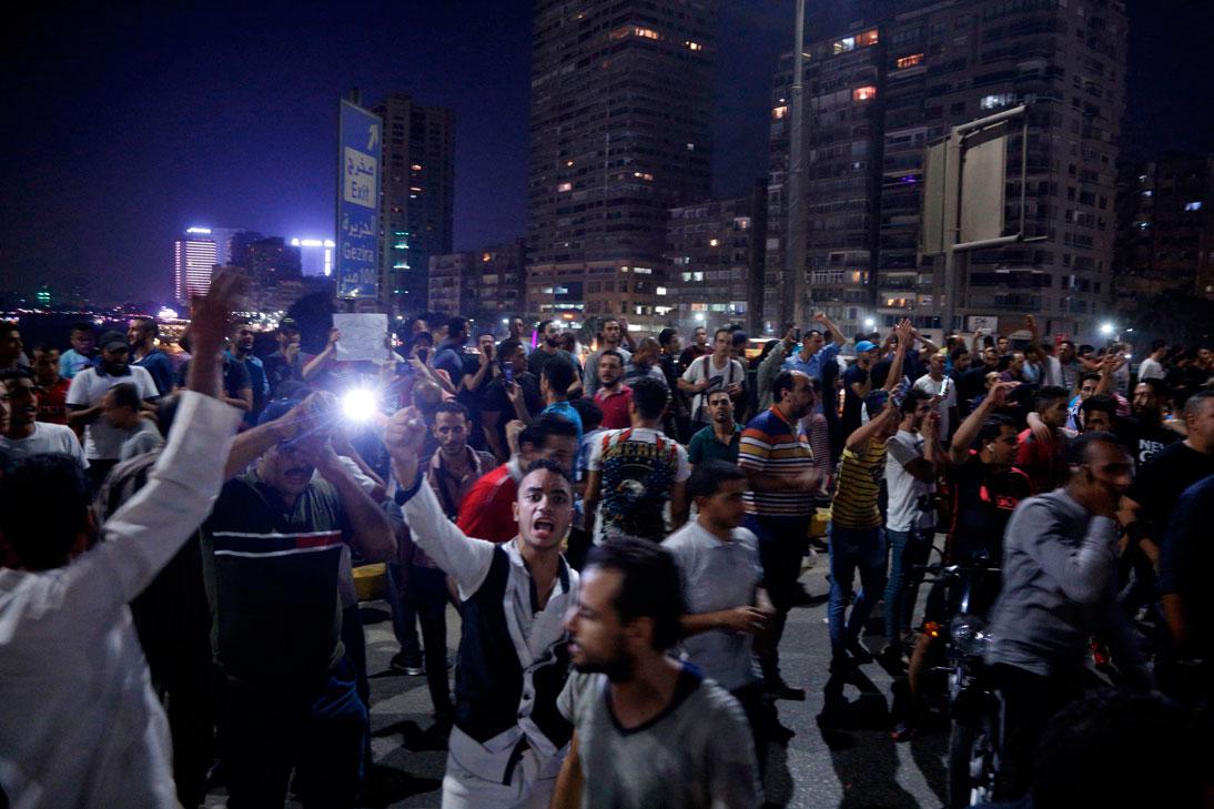 Egyptian protesters shout slogans as they take part in a protest calling for the removal of President Abdel Fattah al-Sisi