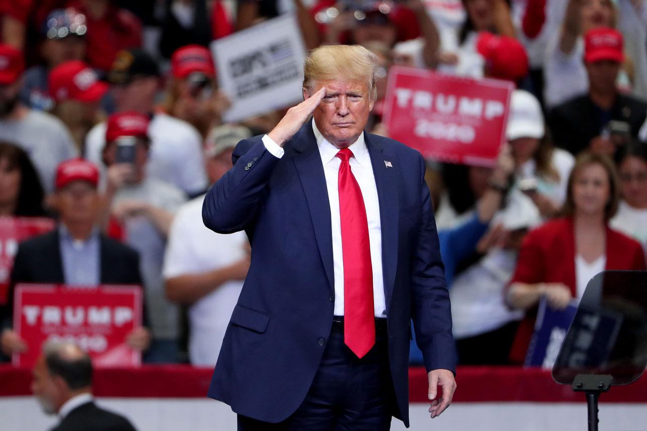 US President Donald Trump gestures during a "Keep America Great" Campaign Rally at American Airlines Center on October 17, 2019 in Dallas, Texas