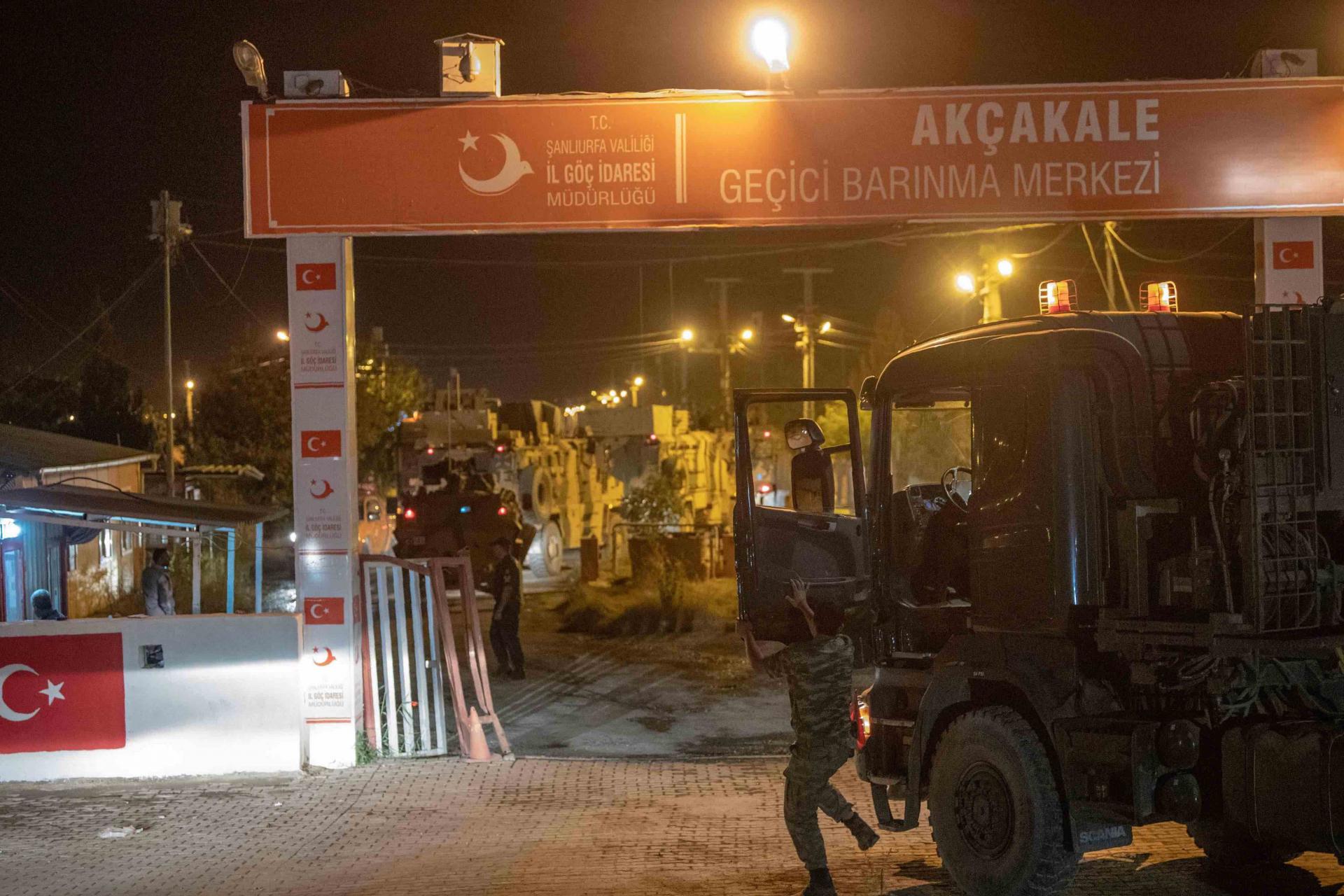 Turkish army soldiers drive towards the border with Syria near Akcakale in Sanliurfa province