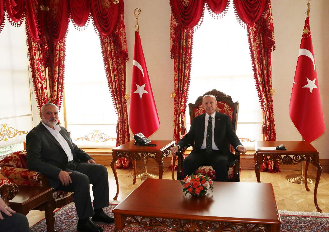 Turkey's President Recep Tayyip Erdogan (R) and Hamas' political bureau chief Ismail Haniya