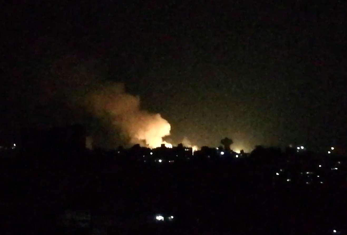 Smoke billowing over buildings