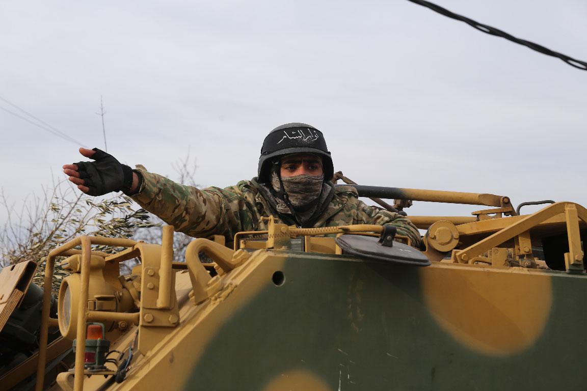 A Turkish backed Syrian fighter preparing to go to the frontline in Idlib province