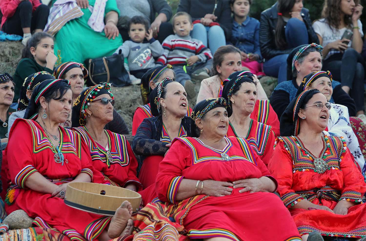 Women spectators watch a match in an annual local soccer tournament played by an all women teams, at the village of Sahel