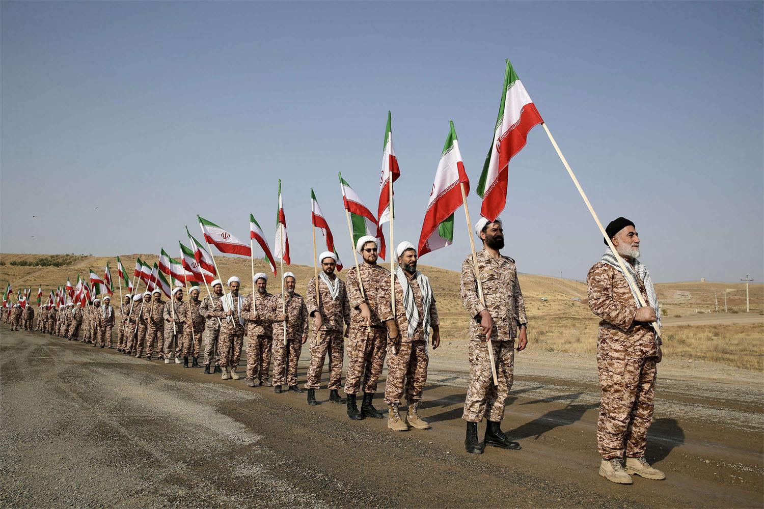 Britain says the sanctioned IRGC officials are responsible for managing the group's financial investments