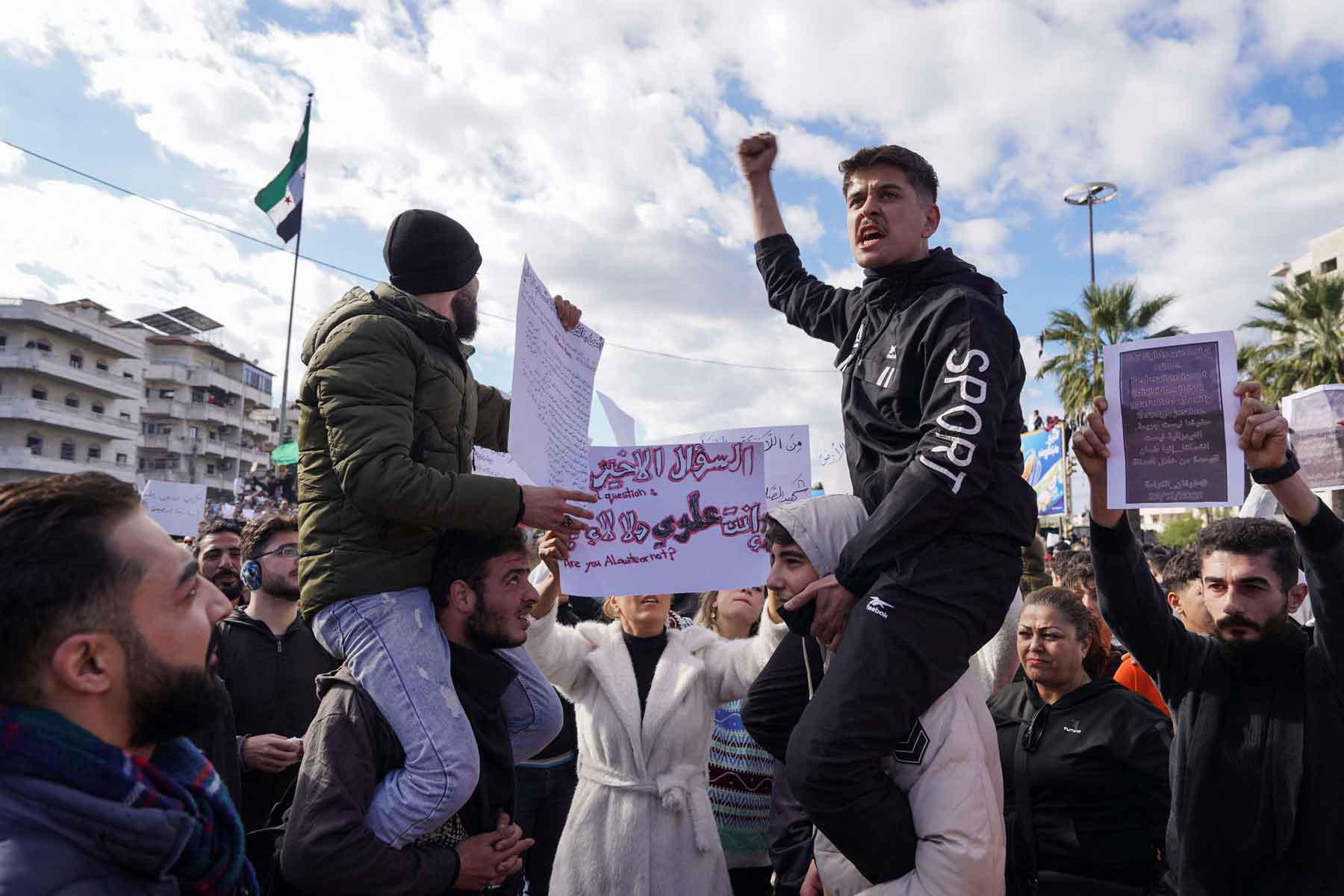 People from the Alawite sect protest as they demand federalism and an end to what they say is the killing and violations against Alawites, in Latakia, Syria, December 28, 2025. 