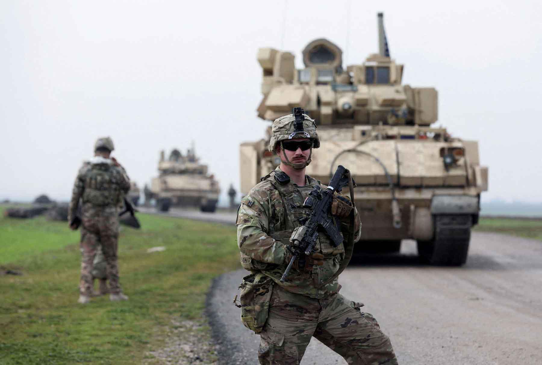 A soldier from the US-led coalition stands guard in the countryside of Qamishli in northeastern Syria, February 8, 2024. 