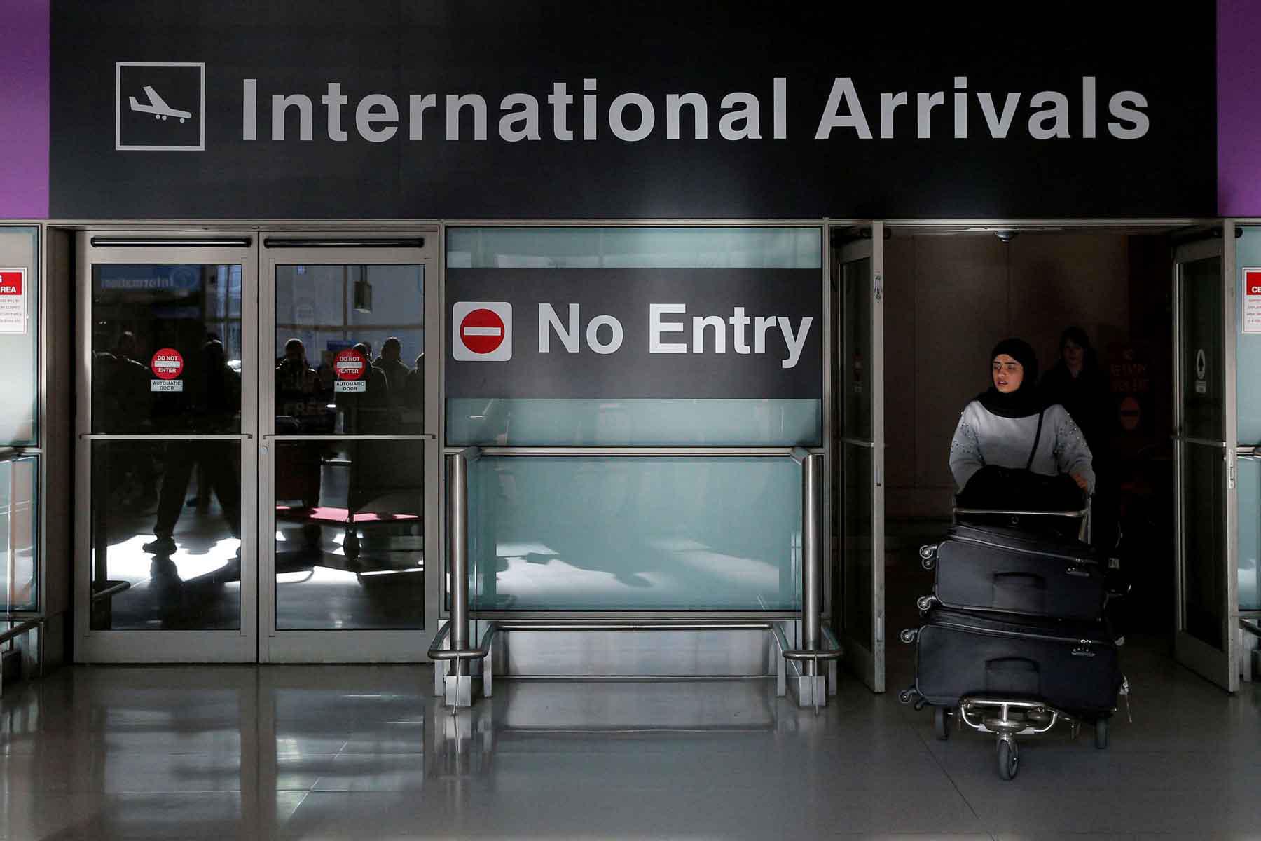  An international traveller arrives at Logan Airport in Boston, Massachusetts, US.
