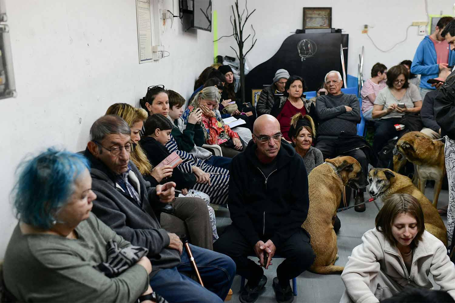 Israelis take cover in a shelter in Tel Aviv