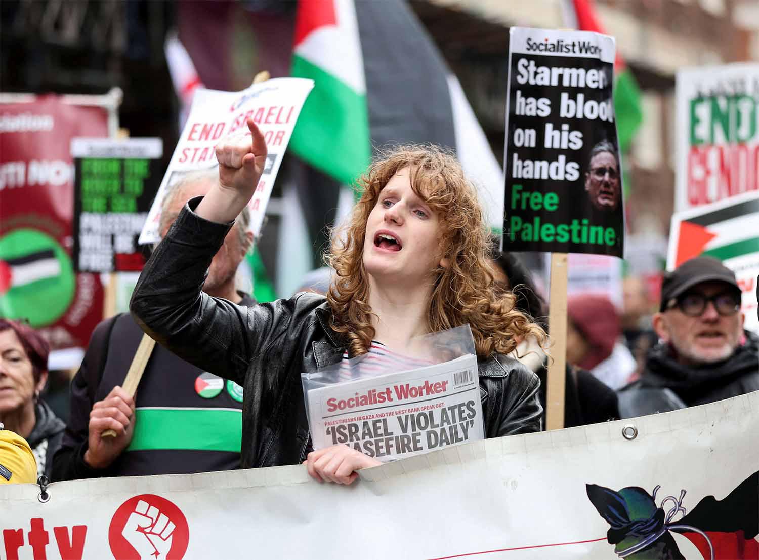 A protester chants during a march organised by the Palestine Solidarity Campaign on the International Day of Solidarity with the Palestinian People in London