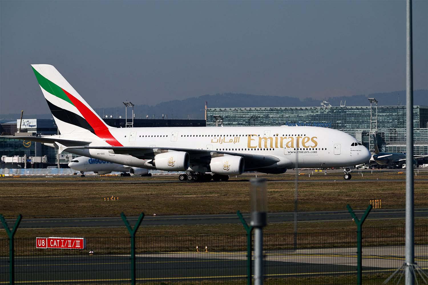An Emirates plane with German tourists evacuated from the Middle East arrives from Dubai
