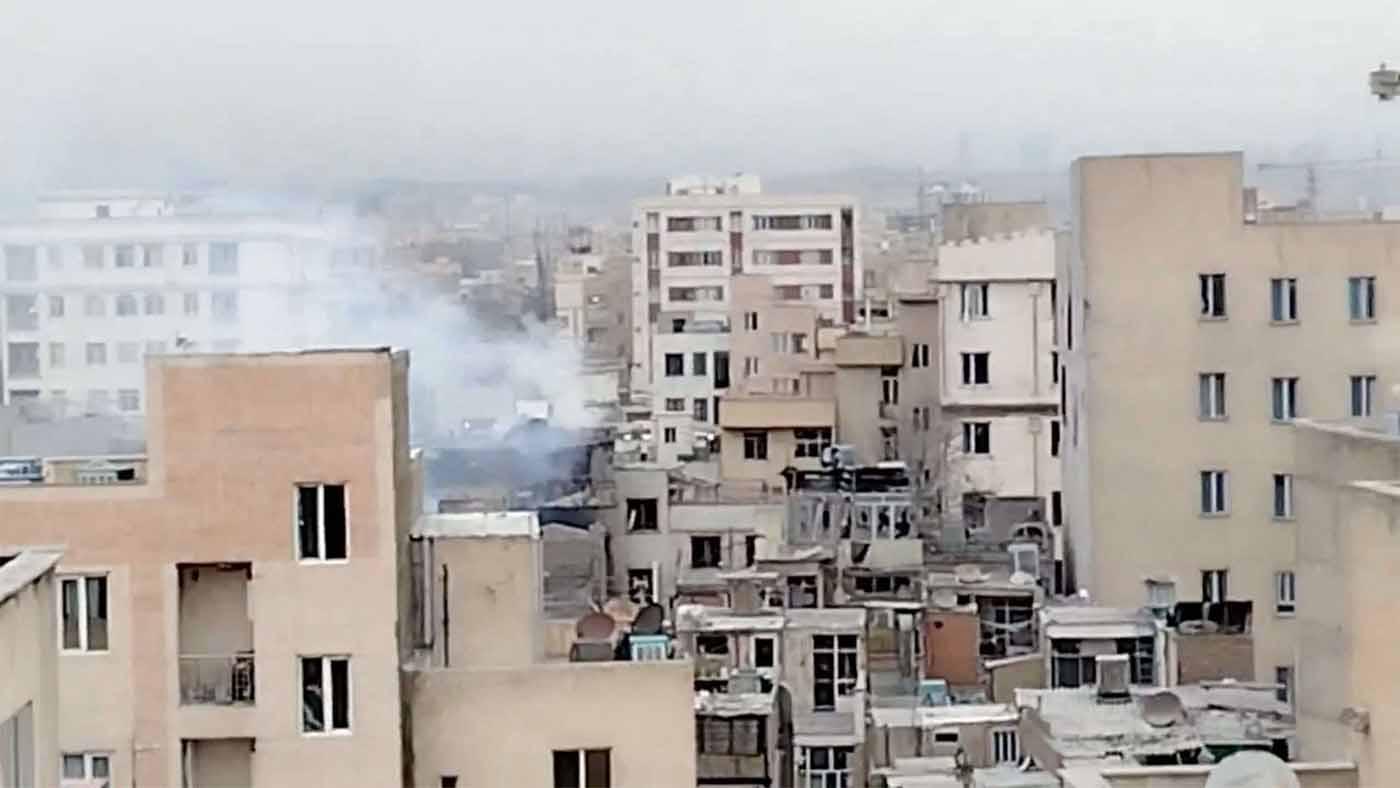 Smoke rises from a building following a reported strike in Tehran