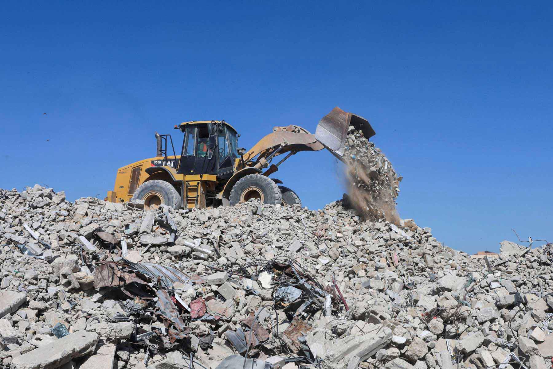 Progress is being slowed by dangers hidden beneath the debris