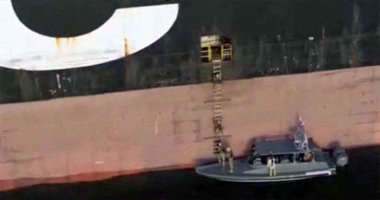 Iran's navy soldiers attacking a ship in the Strait of Hormuz