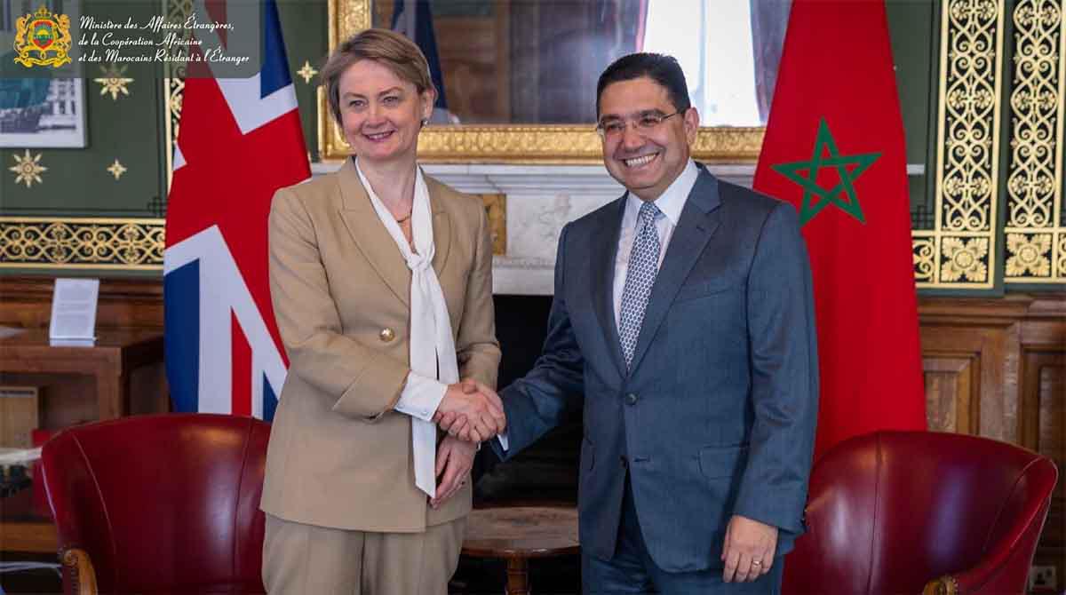 Cooper shaking hands with Bourita in London