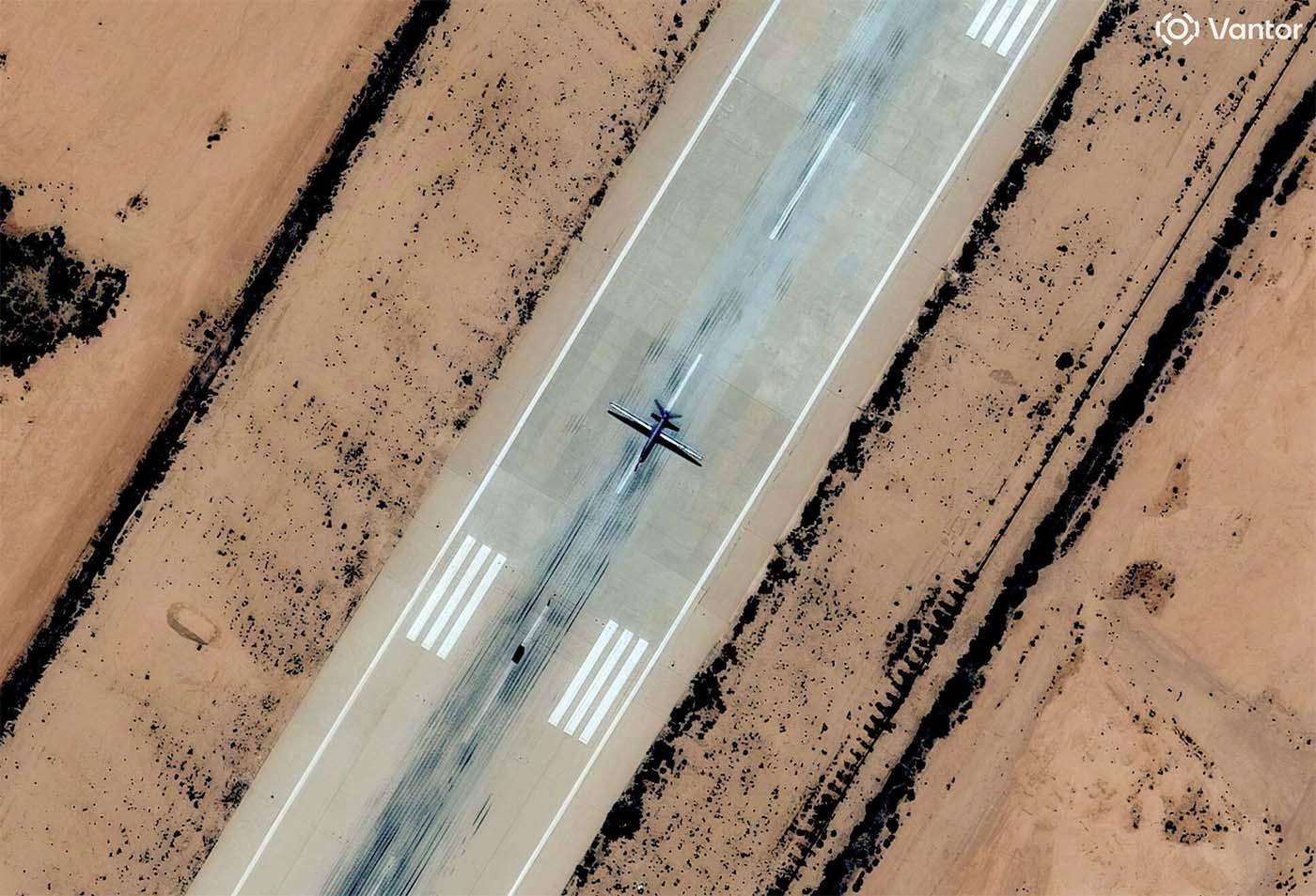 A satellite image shows a combat drone, which experts identified as most likely a Chinese-made Feilong-1, on the runway at Al Khadim airbase